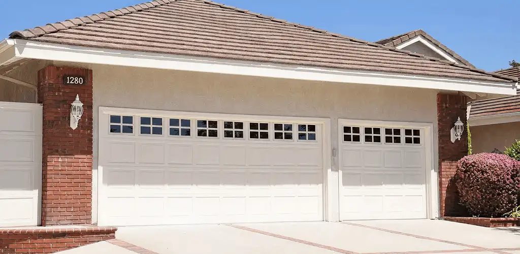 Residential garage door repair service for a double garage door in Louisville, KY