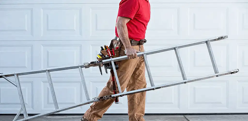 Garage door repair technician arriving with tools and ladder in Louisville, KY