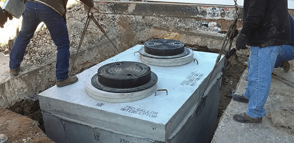 Grease trap installation for a commercial property drainage system in Louisville, KY