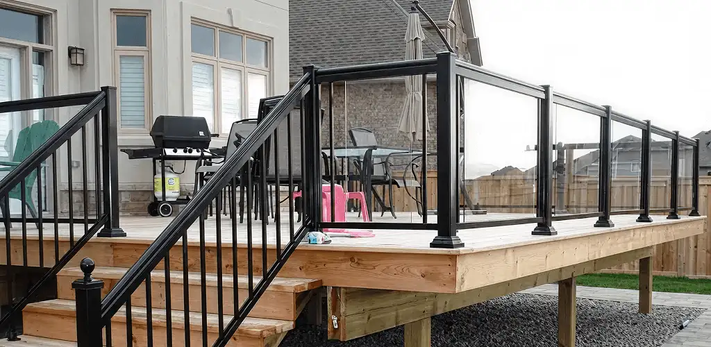 Handrail installation on a deck staircase for safety and code compliance in Louisville, KY