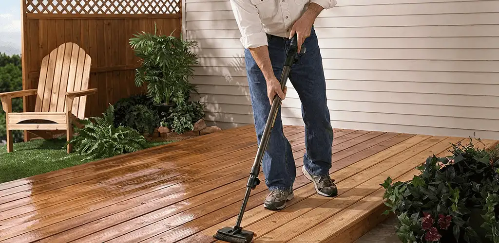 Deck staining service applying stain to a backyard wood deck in Louisville, KY